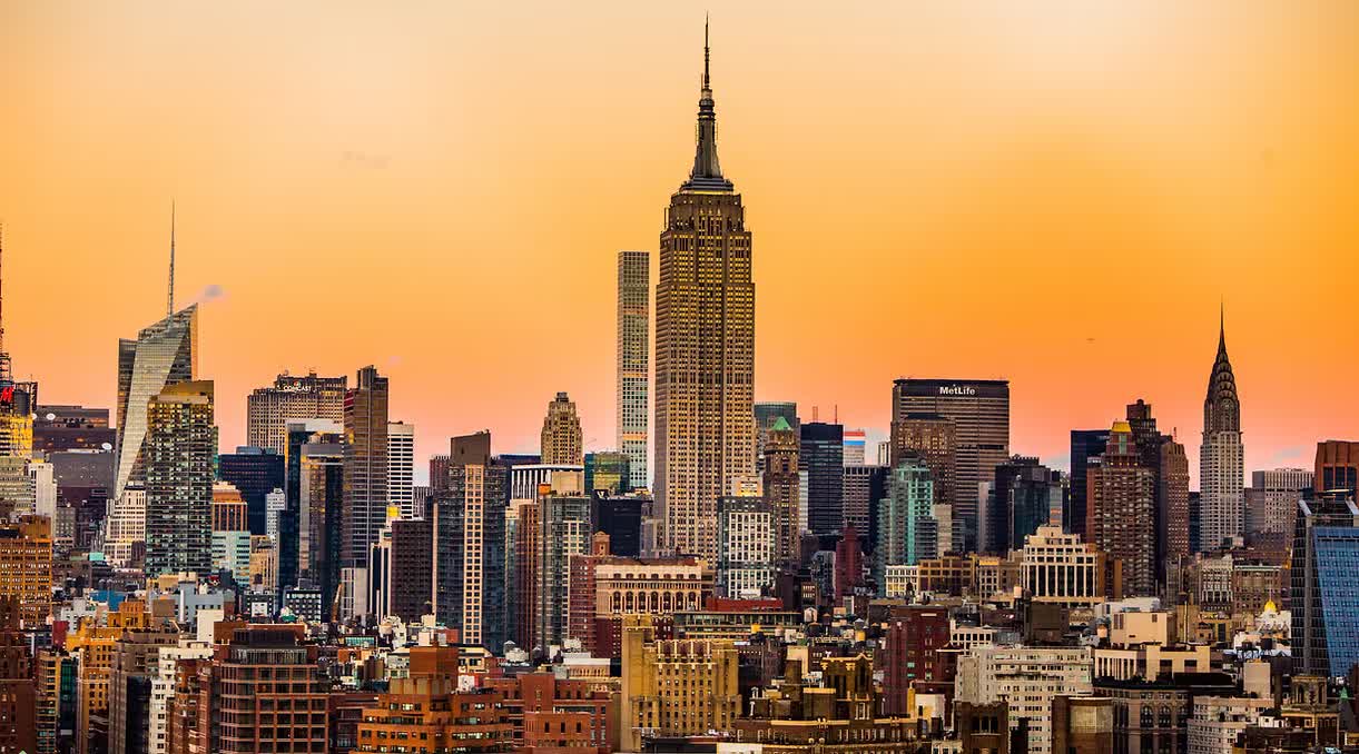 The Midtown Manhattan skyline at sunset with the Empire State Building at its center
