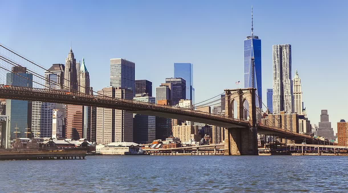 The Brooklyn Bridge with the Lower Manhattan skyline and One World Trade Center behind it