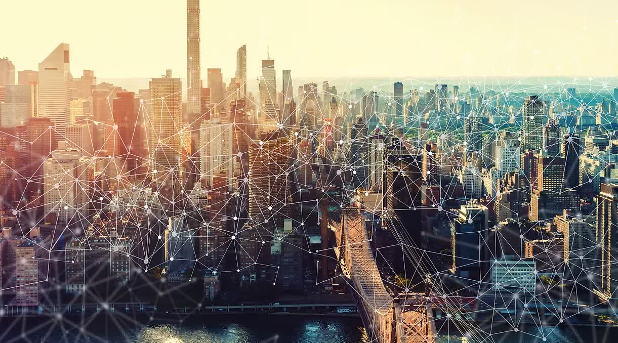 The Manhattan skyline at sunset overlaid with a network of connected points representing global links